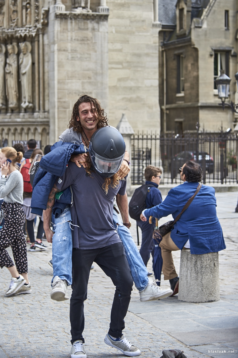 Guys having fun in front of Notre Dame